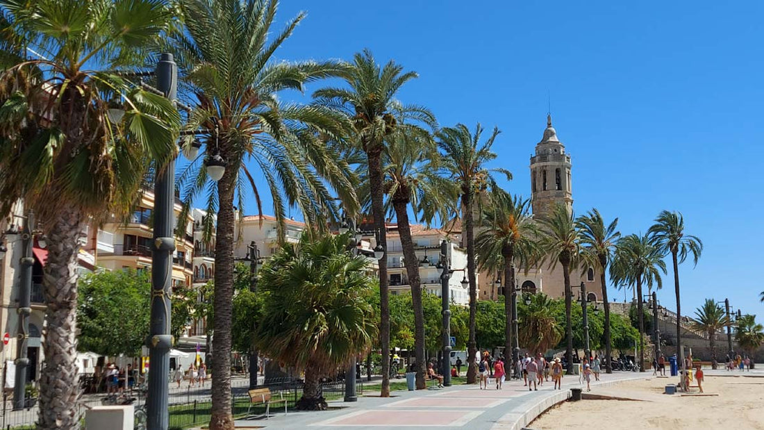 Passeig Maritim Promenade in Sitges with a view to the Church of Sant Bartomeu i Santa Tecla