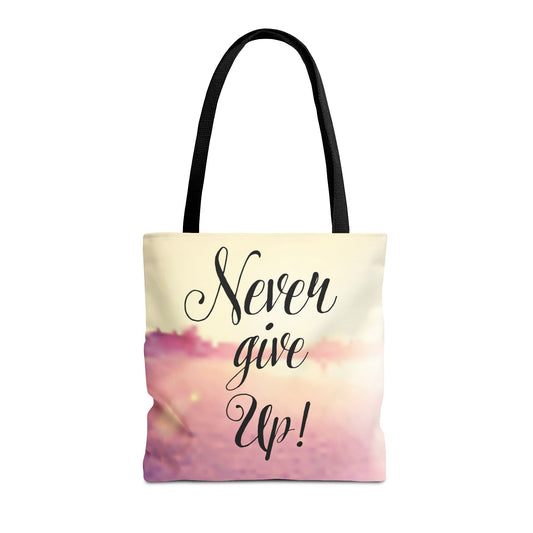 Motivational tote bag featuring 'Never Give Up!' message, black straps, and soft gradient background, ideal for self-care and positive vibes.